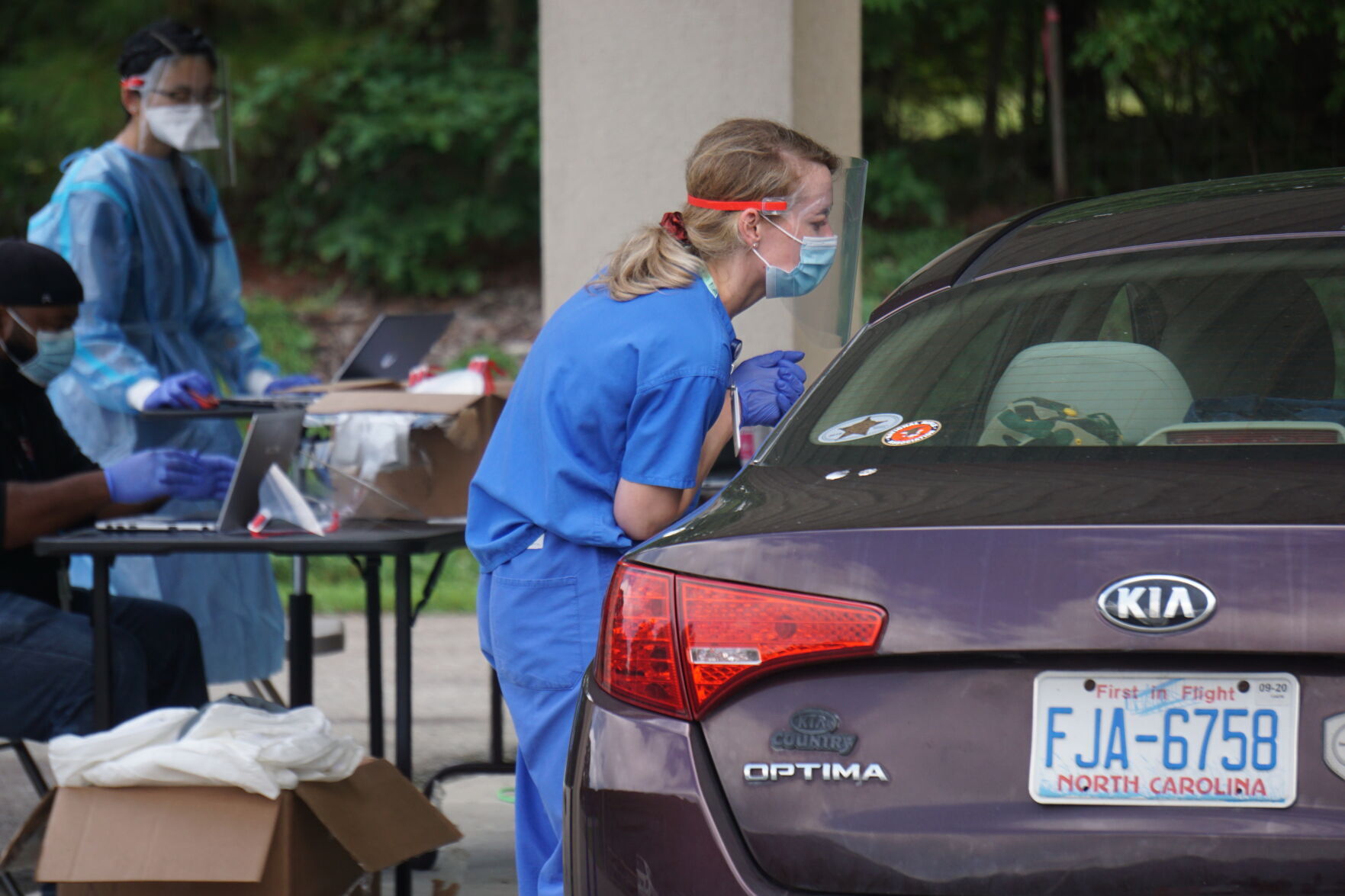 Employees of Piedmont Health administer PCR tests at the Westmoore Community Center in Robbins on Aug. 7, 2020.